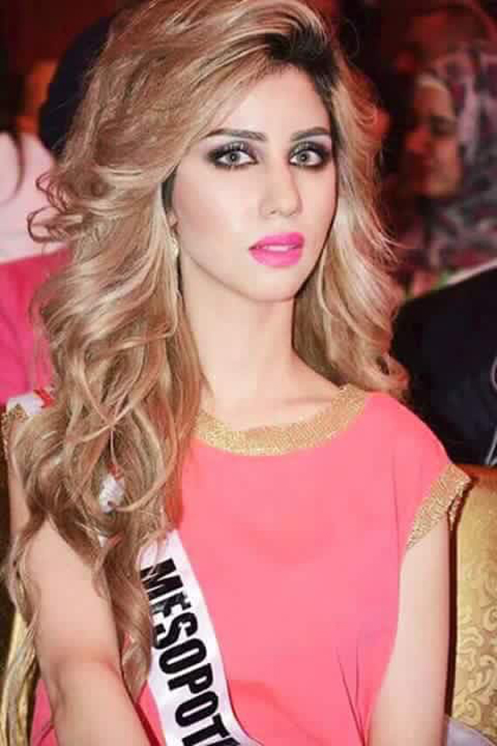 حسناء عراقية تظهر بفستان اثناء عرض البكيني في مسابقة للجمال صورة رقم 6