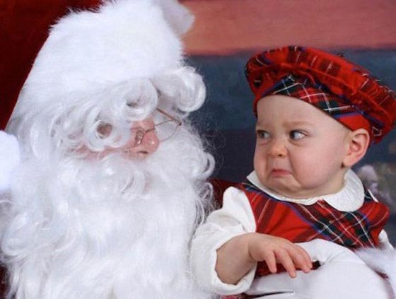 صور طريفة.. لحظات رعب تنتاب الاطفال في اول لقاء مع بابا نويل! صورة رقم 8
