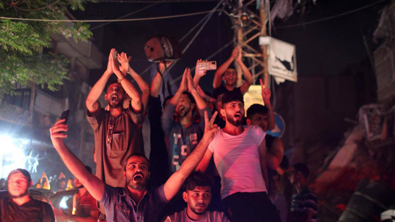 بالصور.. أهالي غزة يحتفلون بوقف إطلاق النار صورة رقم 2