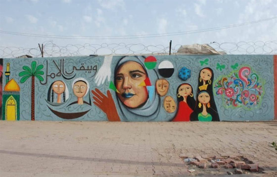 صور: شباب عراقيون يرسمون على حوائط شوارع بغداد لاعادة  البهجة والبسمة للعاصمة واهلها صورة رقم 1