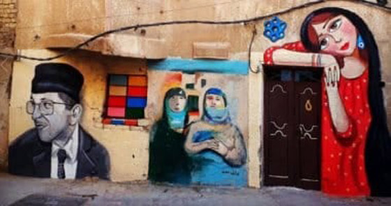 صور: شباب عراقيون يرسمون على حوائط شوارع بغداد لاعادة  البهجة والبسمة للعاصمة واهلها صورة رقم 3