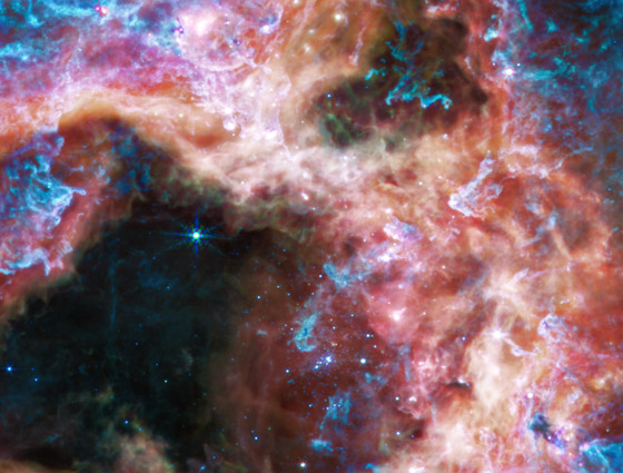 صور مذهلة من الفضاء.. شاهدوا أين تولد النجوم في سديم الرتيلاء صورة رقم 2